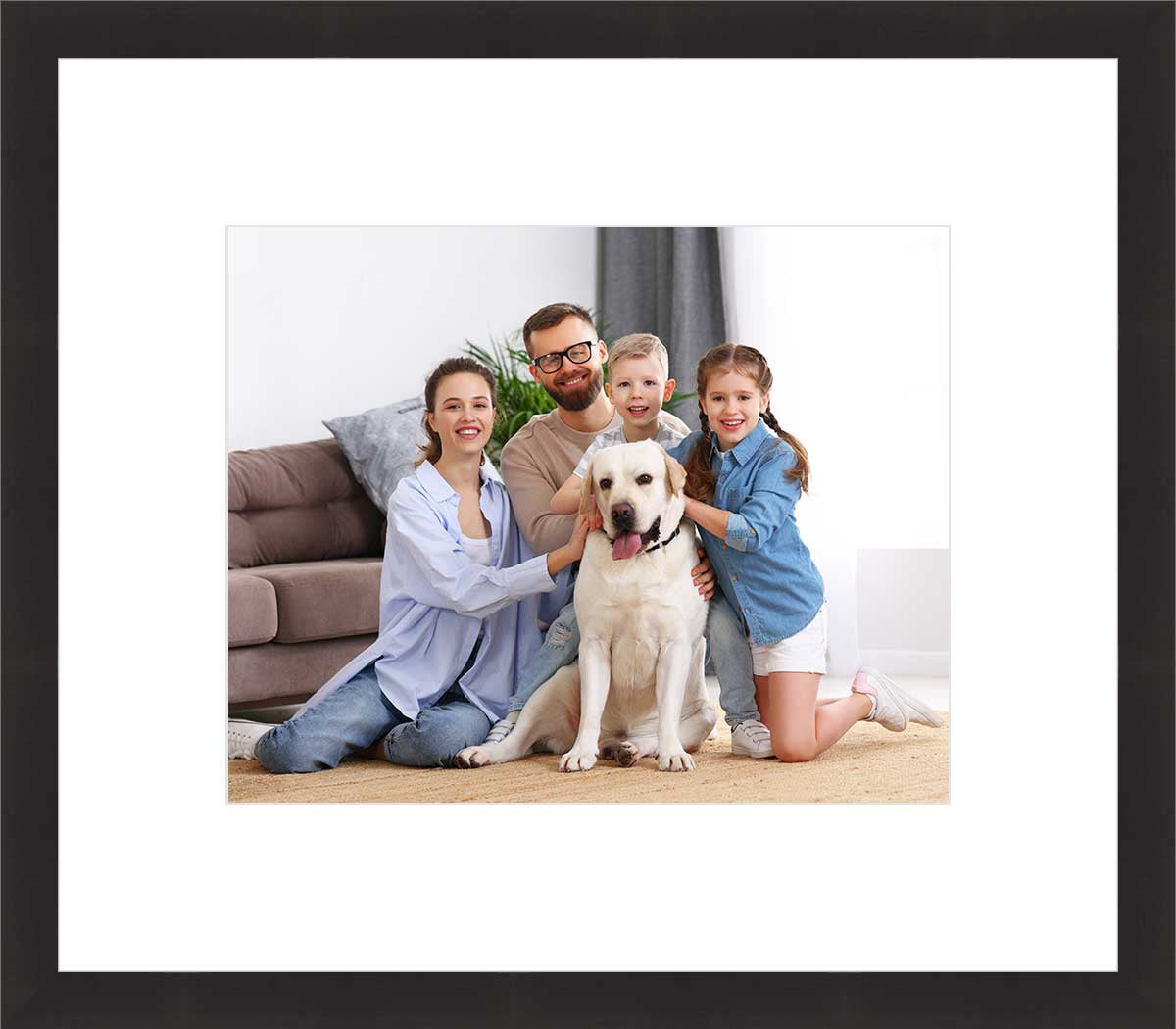 Framed family photo with parents, kids, and a dog.