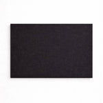 Black rectangular mat on a white background