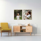 Living room with framed mother-daughter photos above a wooden console.