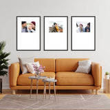 Living room with orange sofa and three framed photos on the wall.